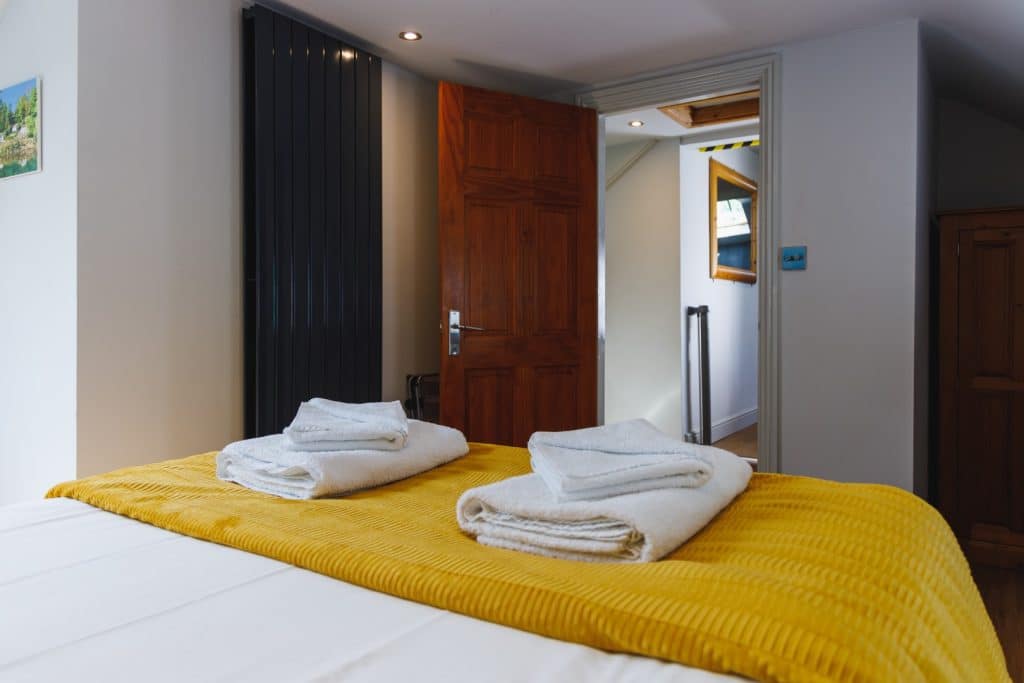 A large bath sheet and a hand towel for every guest